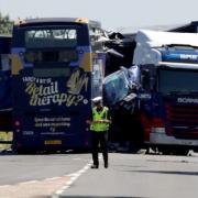 Two men were killed in the crash between a lorry and a double-decker bus at Wisbech St Mary.