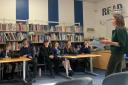 Lucy Frazer MP with students from the Debating Society at Witchford Village College.