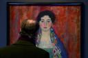 A man looks at the painting Portrait of Fraulein Lieser (Christian Bruna/AP)