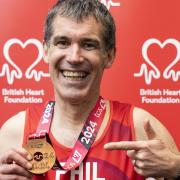 Phil Scurrah, of Burwell, with his medal after completing the London Marathon.