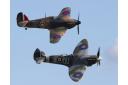 A Spitfire (front) and a Hurricane (back) fly in tandem.