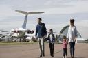 A family exploring IWM Duxford with the American Air Museum in the background. Picture: IWM