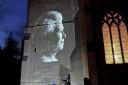 An image of Queen Elizabeth II is projected onto St Andrew's Church in Sutton as the village paused to reflect on the Queen's life.