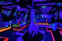 The neon space adventure that you'll find inside GloGolf Peterborough.