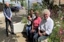 Newnham Street car park in Ely has recently had a transformation. Pictured using the new seating area on June 20 is Cllr Bill Hunt (R) and open spaces and facilities manager Spencer Clark (L) with mother and daughter Blessing Smith and Christy Buckingham