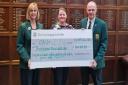Members of Gog Magog golf club raised £34,180 for EACH throughout 2021. Pictured is EACH community fundraising manager Tina Burdett (centre) with club captains Sharon Turvill (L) and Gareth Jones (R).