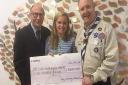 One donation was made to by Arthur Rank Hospice and here presented to Bethany Brown, community fundraiser, by Michael Judkins and Graham Smith on behalf of Ely Community Events Team. Picture: SUBMITTED