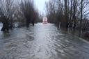 The A1101 Welney Wash Road remains flooded