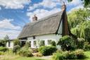 This historic four-bedroom cottage sits in beautiful grounds including a stable block and paddocks