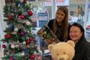 Mandy Watkins, Premier Travel Ely branch manager, and Lauren Raper travel consultant, with some of the new toys donated for Ely Toy Bank by customers.