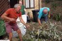 Volunteer gardening team lend a helping hand.