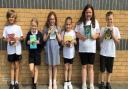 Students at Littleport Community Primary School with their new books thanks to the seventh year of MP Steve Barclay's annual Read to Succeed campaign.