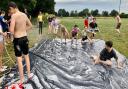 The Port youth club enjoying Slip n Slide will be litter picking the Leisure Centre fields in their summer holidays!