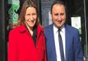 Anil Sharma (right) with Lucy Frazer MP outside Haddenham Pharmacy on Station Road.