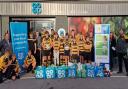 Ely Tigers Under 14s were supported by the Ely Co-op on St Mary\'s Street and are pictured with food bags to go towards Ely Foodbank.