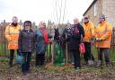Members of the Ely Inter Wheel club and the ECDC team planting the tree for the Queen's Green Canopy.