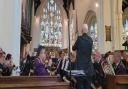 Littleport Brass Band's musical director Ian Johnson conducts a concert at St George's Church Littleport