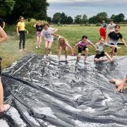 The Port youth club enjoying Slip n Slide will be litter picking the Leisure Centre fields in their summer holidays!