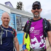 Alun Bradshaw with friend and colleague Pete Mills, who cycled alongside him during his epic marathon challenge.