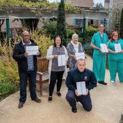 A dozen iPads have been delivered to Addenbrooke's Critical Care Unit in Cambridge after a fundraiser was launched in memory of firefighter Danny Granger, who was treated there. From back left: Jill Hyde, Mel, Katie, Margaret and critical care staff.