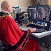 Mayor of Wisbech Cllr Aigars Balsevics adopts a 'civic business as usual' stance as he attends an online service hosted by the mayor of Northampton.