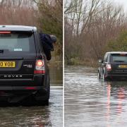 Motorists pictured at the flooded Welney Wash Road on Wednesday (January 27).