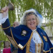 Ely's town crier Avril Hayter-Smith (pictured) is retiring from her role after 20 'dedicated' years of service.