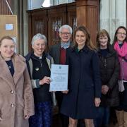 SE Cambs MP Lucy Frazer has welcomed £13m of funding for Cambridgeshire as part of the government's 'levelling up' plans. Pictured is Ms Frazer with Reverend Sue Giles, priest-in-charge at Holy Trinity church, Bottisham as part of her Covid community