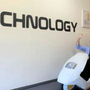 Dave Bausor, lead practitioner for design and technology at Ely College, cruised around in a Sinclair C5 during an open evening for prospective students.