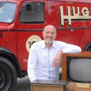 Robert Hughes (pictured) and the special van recreated to celebrate Hughes Electricals’ 100 years in business.