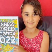 Rahma (pictured) will be drawn onto the front of the Guinness World Records 2022 book cover, climbing the world's largest sandcastle.