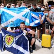 Scotland fans at Central station in Glasgow as they prepare to travel to London ahead of the UEFA Euro 2020 Group D match between England and Scotland.
