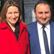 Anil Sharma (right) with Lucy Frazer MP outside Haddenham Pharmacy on Station Road.