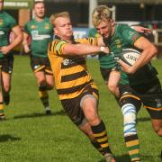Ely Tigers\' Luke Turner tries to prevent a Bury attack