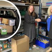 Weightwatchers studio coach, Michelle Allen (R) delivered ?250 of goods to The Trussell Trust on October 14.