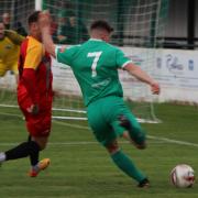 Ollie Ward (in green) is unlikely to feature again for Soham Town Rangers this season after joining the Royal Marines.