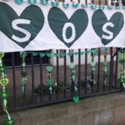 City of Ely WI have crafted displays of crafted green hearts to raise awareness of climate change.
