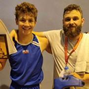 Terry Mills of Haddenham and Ely ABC with coach Jack Frasier after winning at the Amateur Boxing Alliance National Schools Championships.