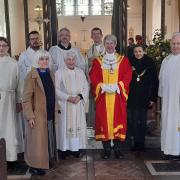 Ely mayor, Cllr Richard Morgan, welcomes new priest to St Peter's Church.