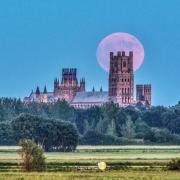 The 'Strawberry Moon' captured behind Ely Cathedral on Saturday evening.