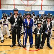 Students from the Mark Farnham Schools of Tae Kwon-Do with their medals from the 2023 Welsh Championships.