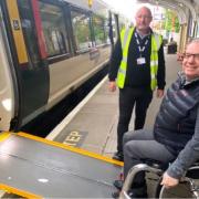Downham Market - mobile assistance team member John Francis assists passenger Gio Strawbridge