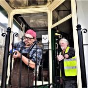 Metal sculptor Tim Peacock finishes the Heritage Centre gate assisted by Ian Stevens
