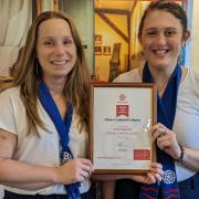 Jess and Sarah from Oliver Cromwell's House with the 'Hidden Gem' award.