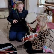 Children and adults tried their hand at drumming, courtesy of the Witchford Drum circle.