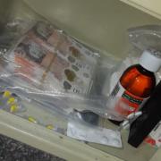 A search of Benjamin Brown's home uncovered drugs, more than £15,000 in cash and sticky labels with his “business logo”.