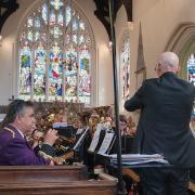 Littleport Brass Band's musical director Ian Johnson conducts a concert at St George's Church Littleport