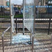 The bus shelter window was smashed using a drain cover.