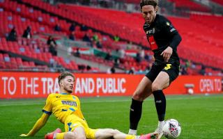 Lewis Simper (left) battles with Harrogate Town's Dan Jones during the Buildbase FA Trophy 2019-20 Final at Wembley Stadium in London.
