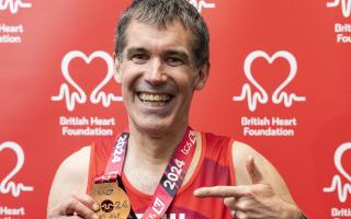 Phil Scurrah, of Burwell, with his medal after completing the London Marathon.